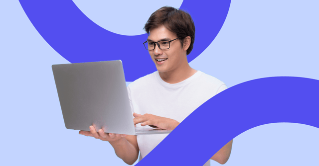 Smiling person in glasses and a white t-shirt typing on a laptop against a light blue background with purple WorkTango brand curves.