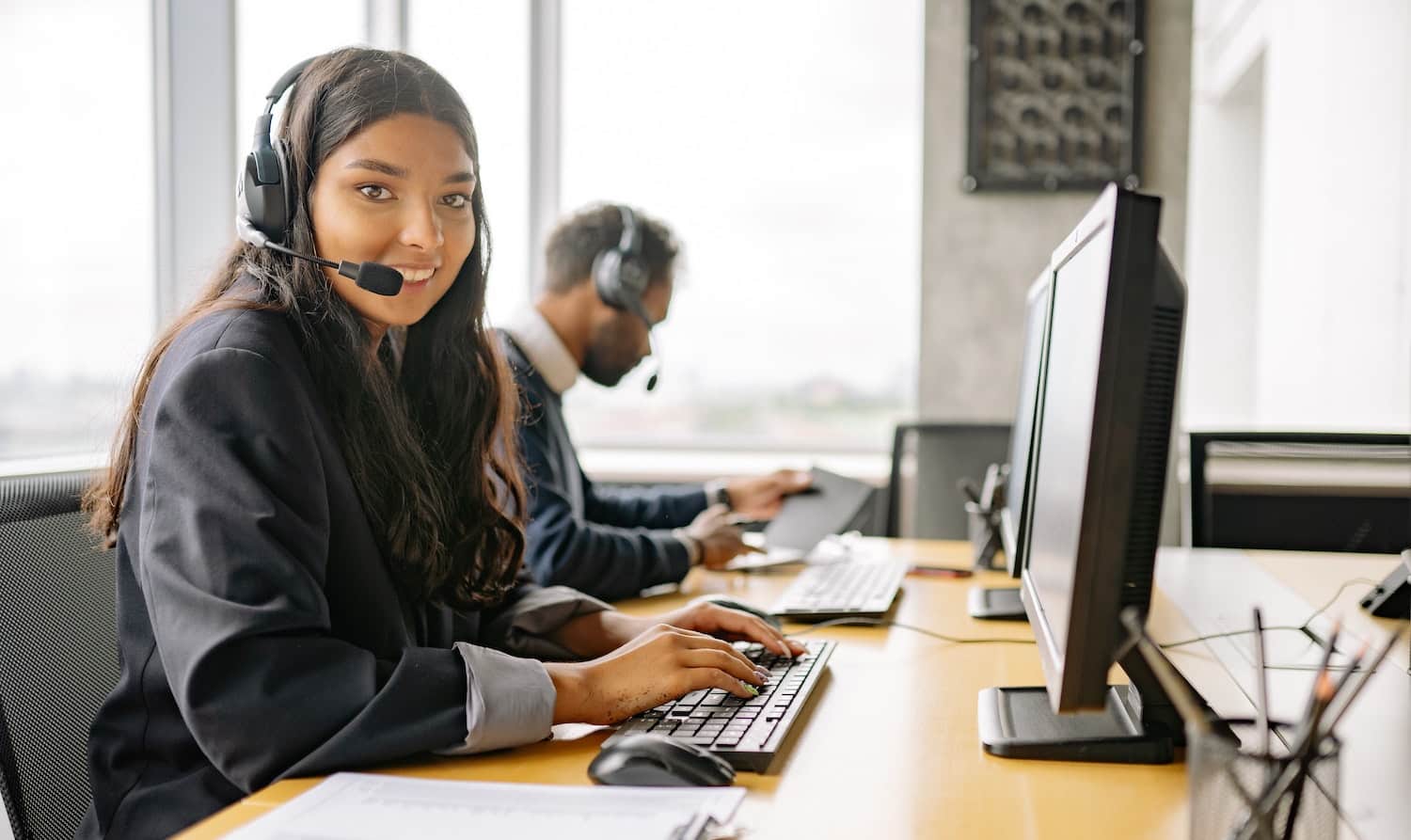 enterprise customer success manager - woman working with headset